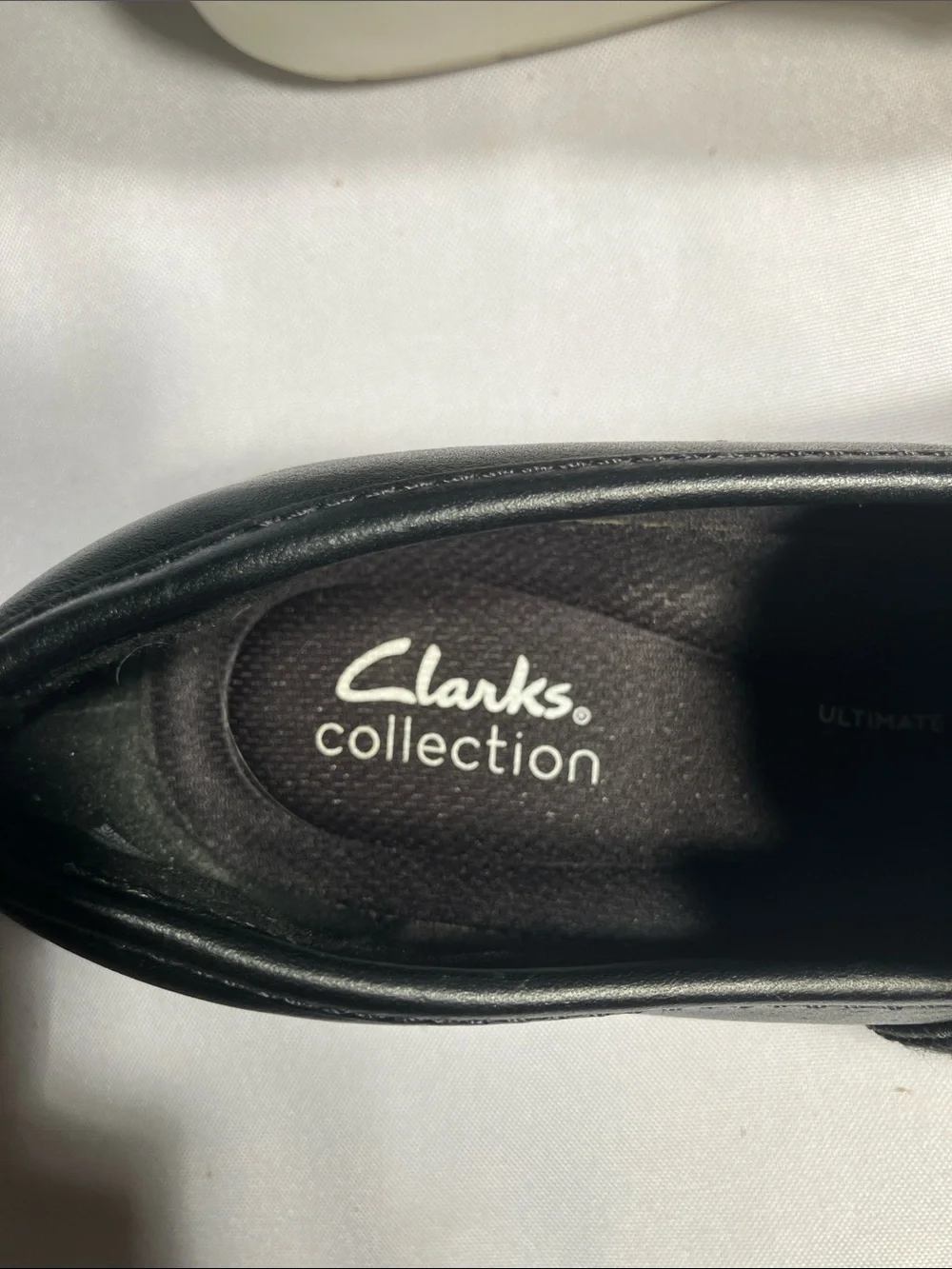 Clarks Black Textured Slip-On Loafers with White Sole